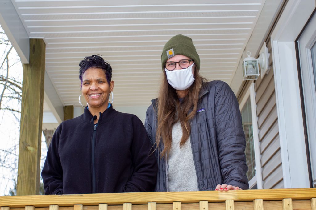 Stephanie Bego, left, and Julie Thompson of Appalachian Service Project, stand on the porch of Bego’s new home on Charleston’s West Side. The home was funded, in part, through the Home4Good program – a partnership between Federal Home Loan Bank Pittsburgh and the West Virginia Housing Development Fund.