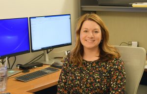 Maggie Leaptrot, the Fund's new Chief Financial Officer, sits at her desk.