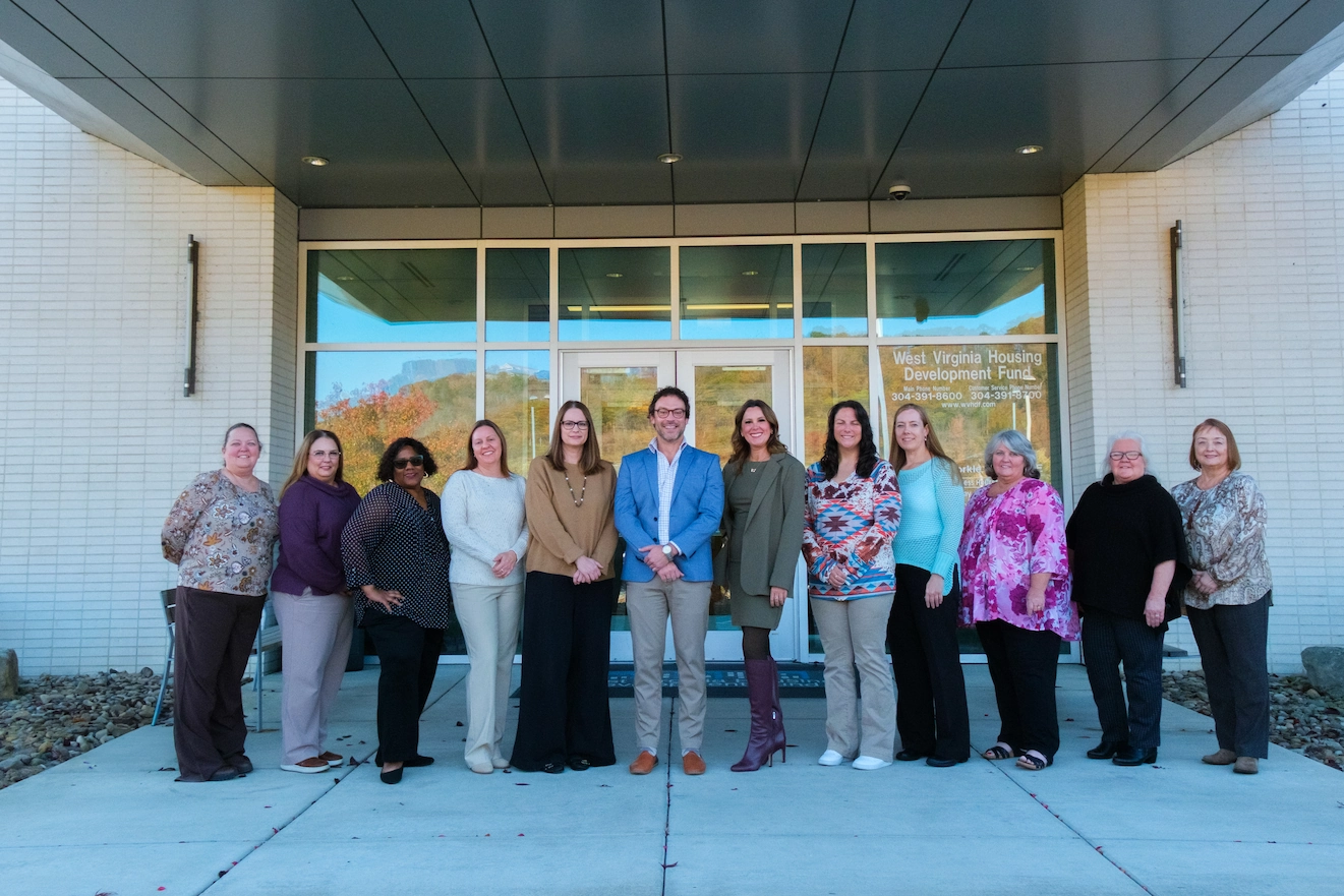 Dedicated WVHDF staff standing outside the Housing Development Fund office, supporting affordable housing across West Virginia