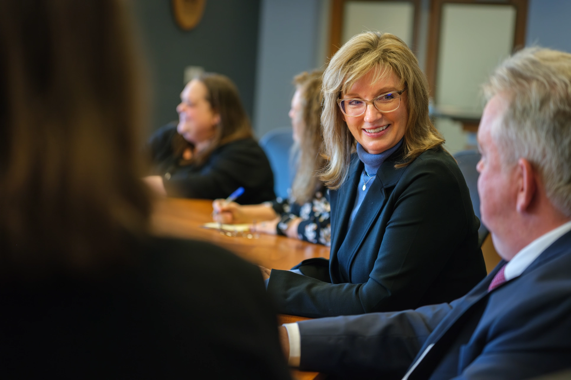 WVHDF multifamily team members meeting at a conference table in a professional office setting